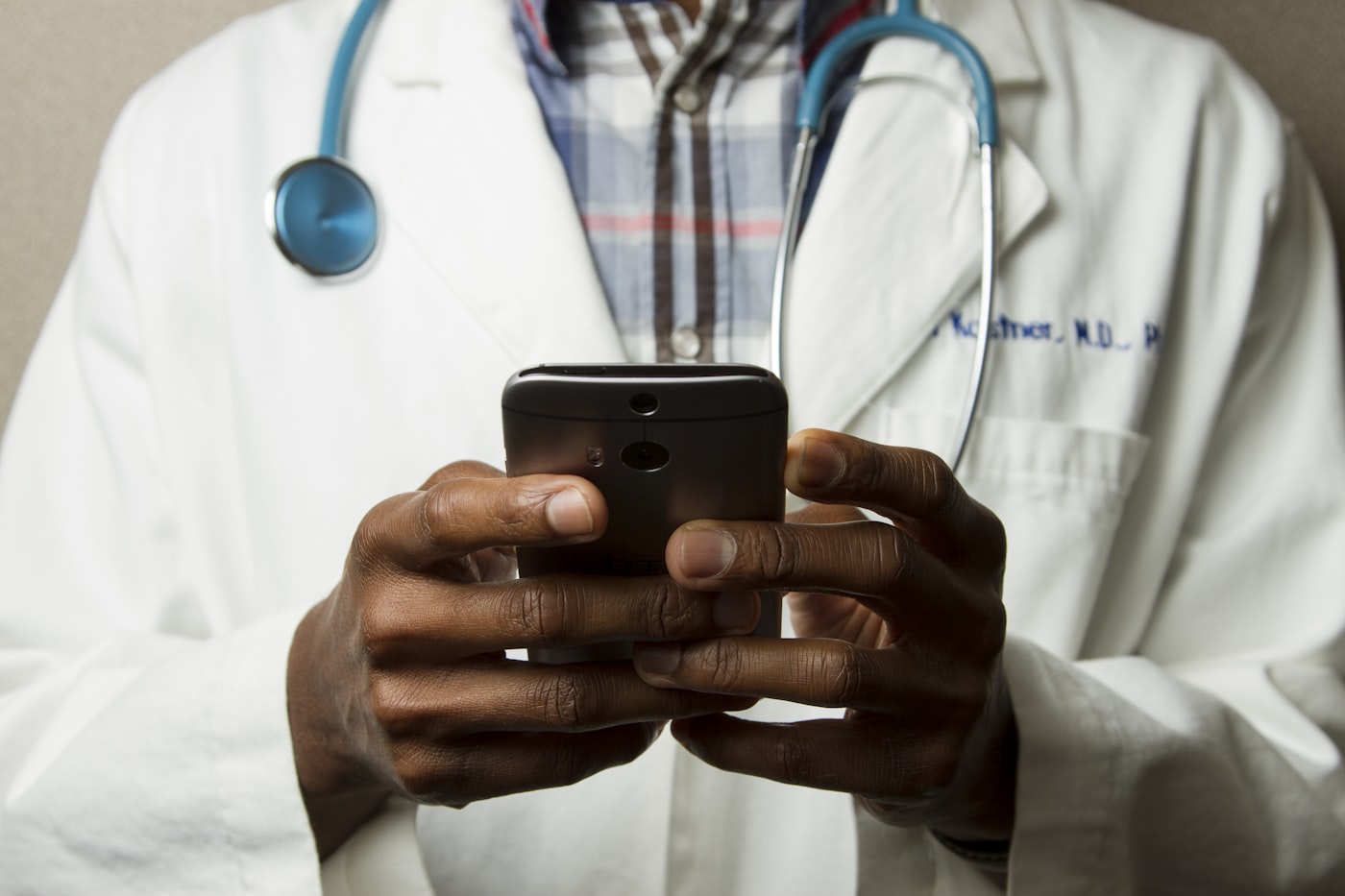 Clinician reviewing patient information on a mobile device